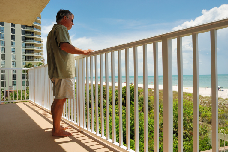 Mature male on holiday at beach apartment